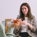 Sincere female counselor speaking with crop unrecognizable woman gesticulating during psychological session on white background - Photo by SHVETS production on Pexels